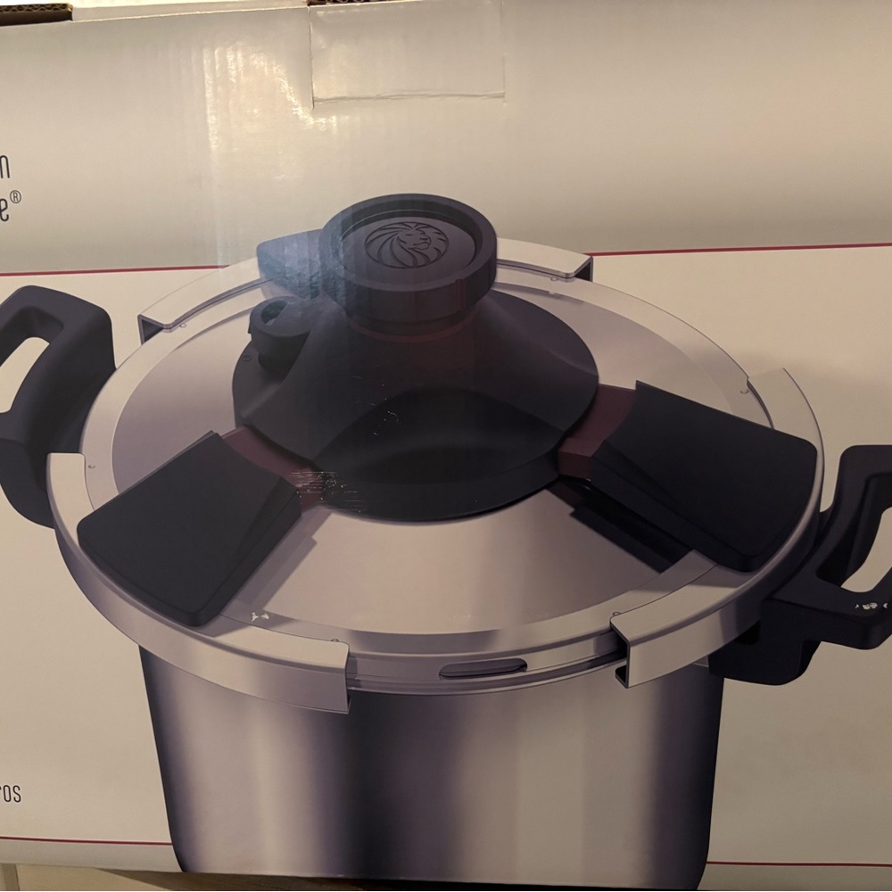 Stainless Steel Pressure Cooker with Black Handles